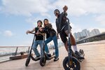 Ninebot-eKickScooter-E2-Pro_Lifestyle-picture_Friends-standing-KickScooter.jpg